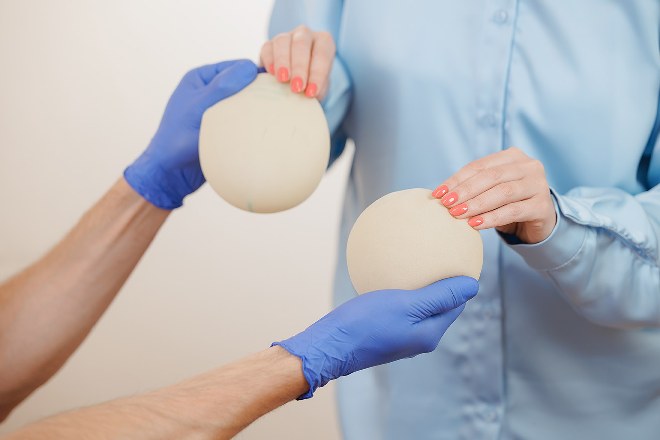 Breast augmentation consultation with options being discussed.